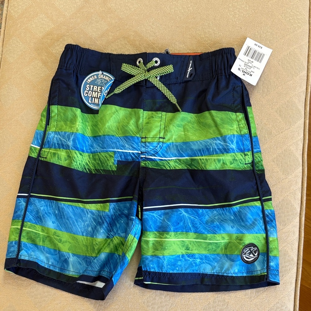 NWT Swim trunks size 5/6.